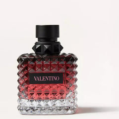 Valentino perfume bottle with red and black design on a white background