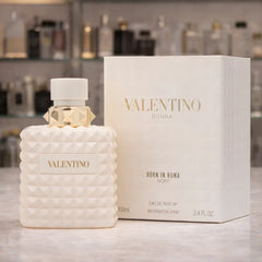 Valentino perfume bottle and packaging on a blurred background