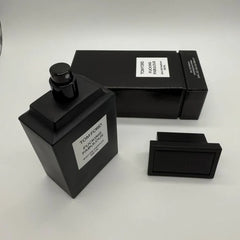 Black Tom Ford perfume bottle and packaging on a white background