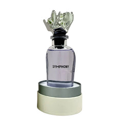 Perfume bottle with decorative cap on a white background