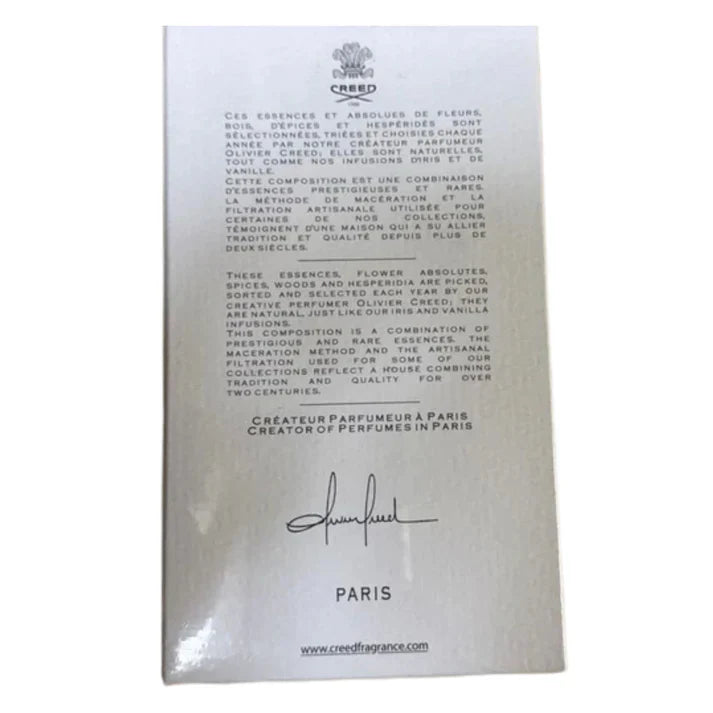Creed perfume packaging with text and logo on a white background