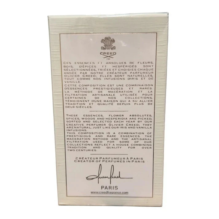 Creed perfume packaging with text and logo on a white background