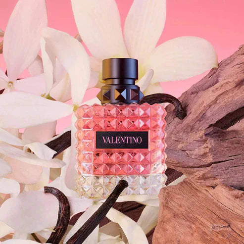 Valentino perfume bottle with geometric design on a floral background