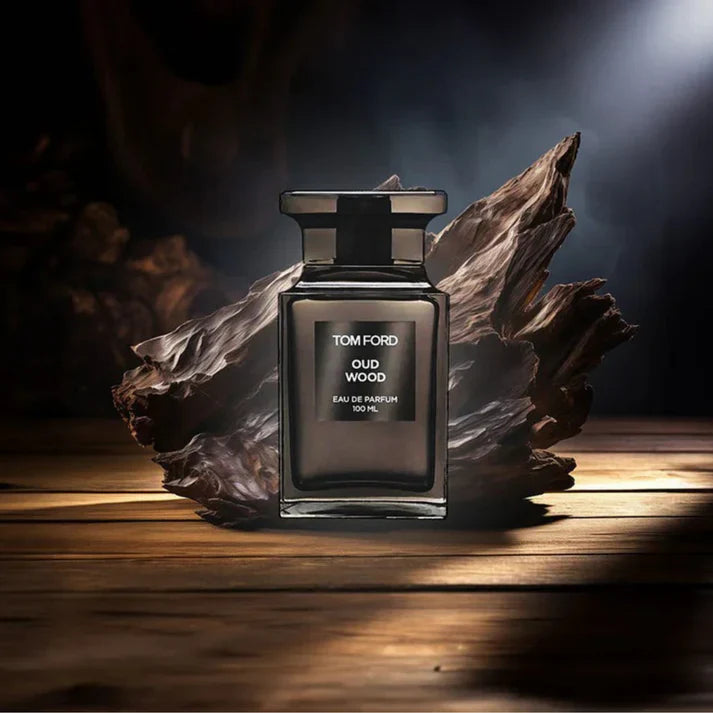 Tom Ford Oud Wood perfume bottle on a wooden surface with dark background