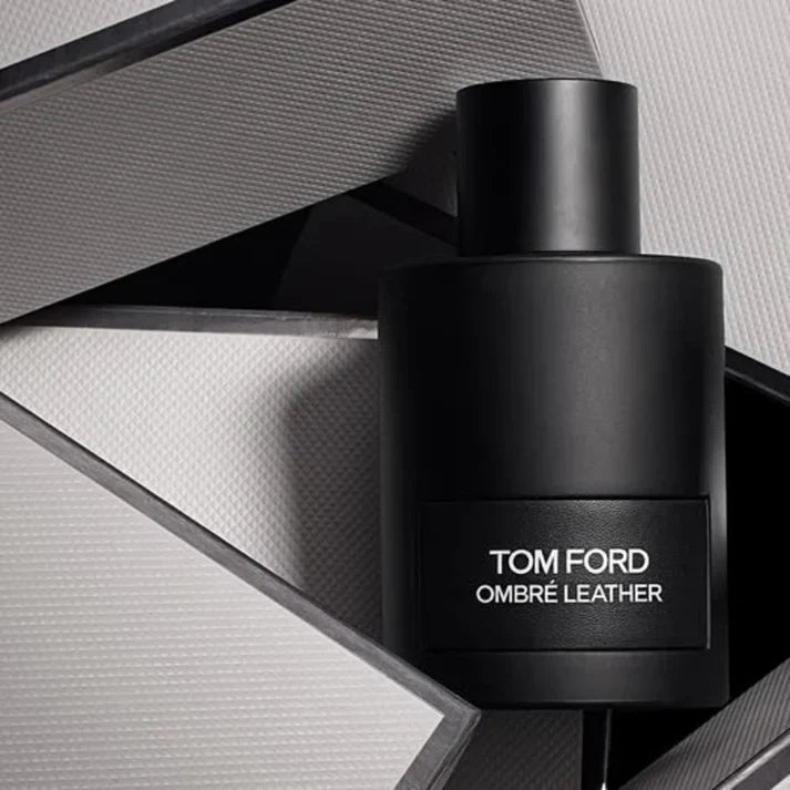 Black Tom Ford Ombre Leather perfume bottle on a geometric background
