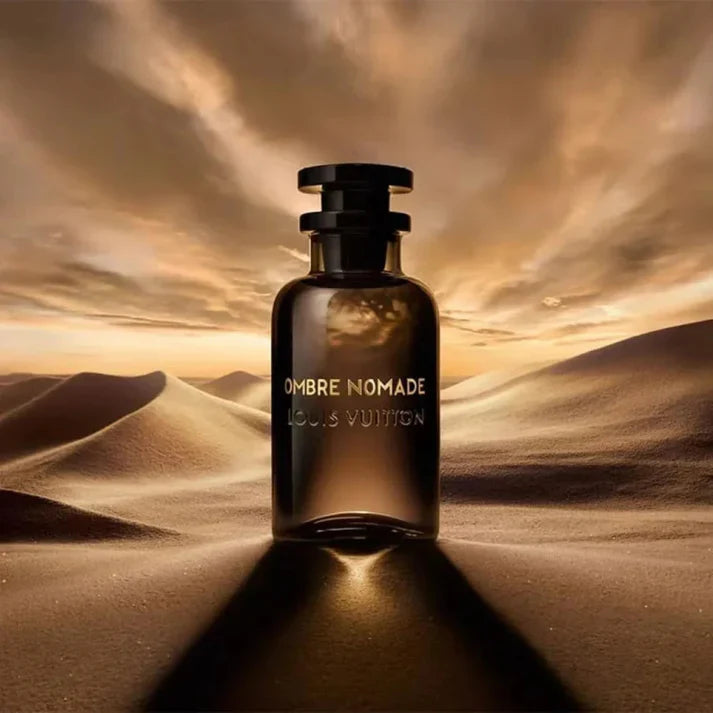 Louis Vuitton Ombre Nomade perfume bottle against a desert landscape